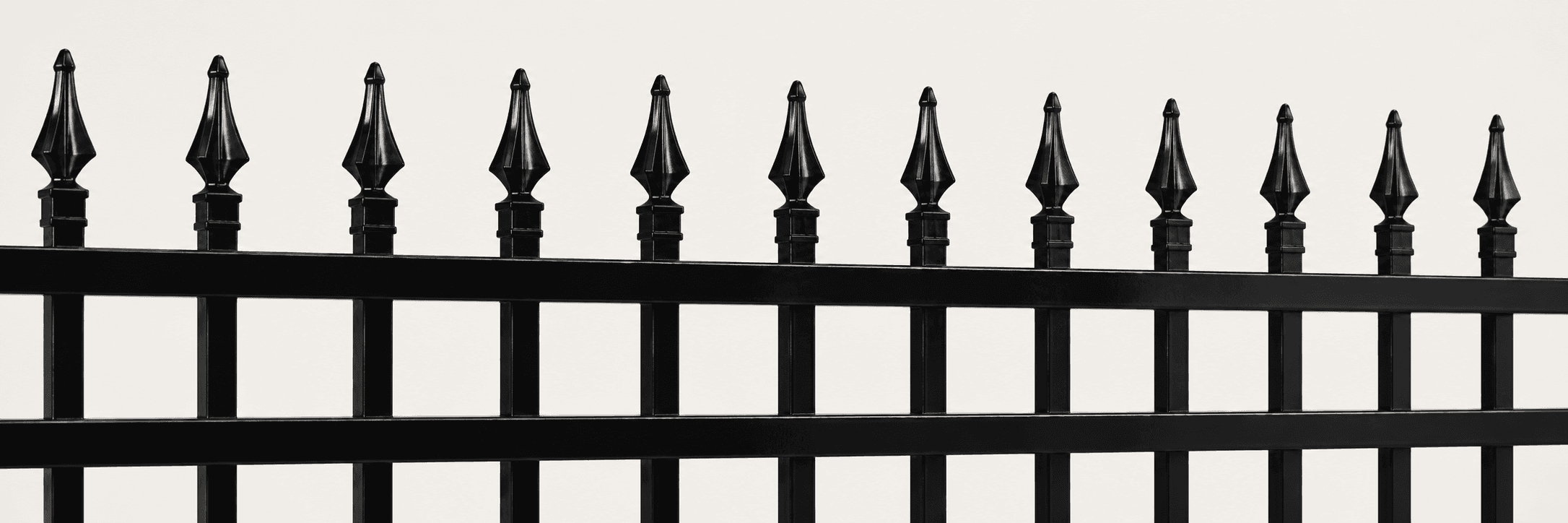 Full-width view of a gloss-black spear-top steel fence panel